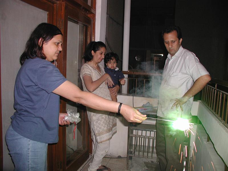 PA160115.JPG - Devraj and Rohan watching Seema light the sparklers