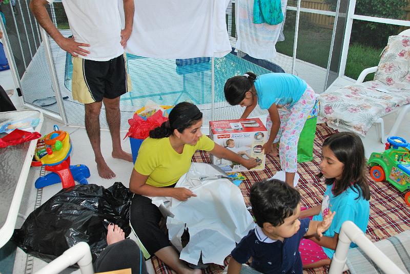 DSC_0784.JPG - Okay he is tired of eating the wrapping. It is left to Mum, Nandi and Tara to open the gifts