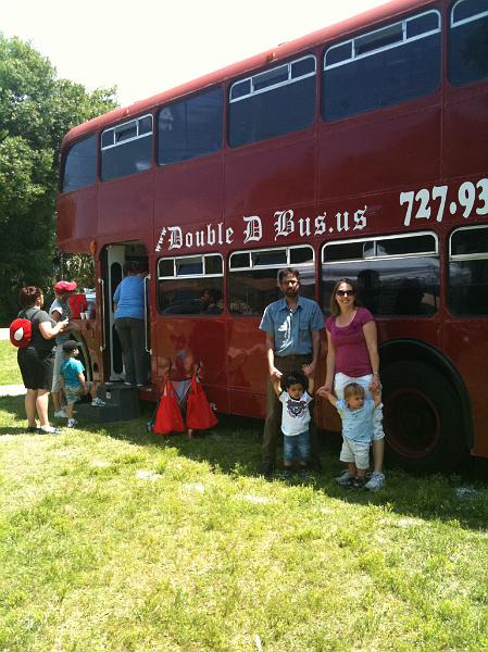 IMG_0079.JPG - Jake with his Mom Dawn and Rohan with his Dad with a double decker bus as the back drop